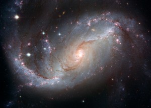 StellarNurseryinthearmsofNGC1672spacetelescope.org